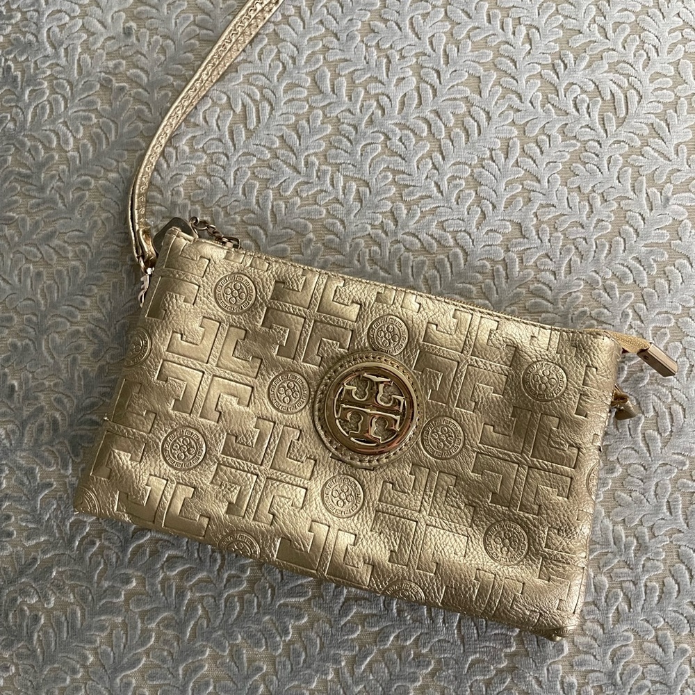 Rare Tory Burch gold embossed clutch.